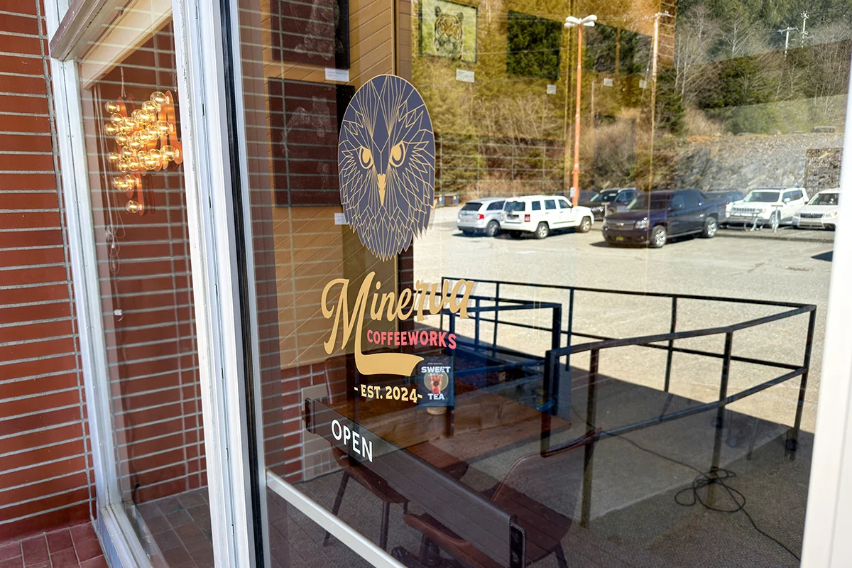 The entrance window of a coffee shop called “Minerva Coffeeworks.”
